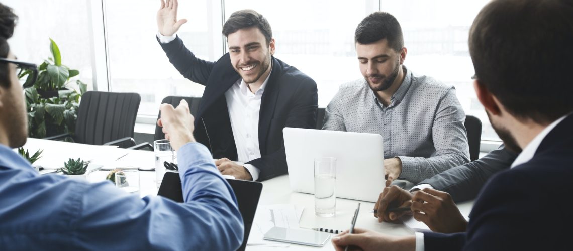 businessman-raising-hand-and-asking-question-at-meeting.jpg