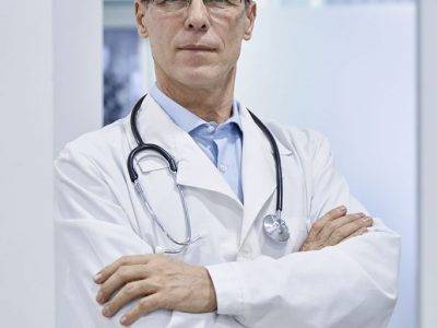 confident-old-medical-professional-doctor-standing-2021-09-02-08-41-38-utc-683x1024